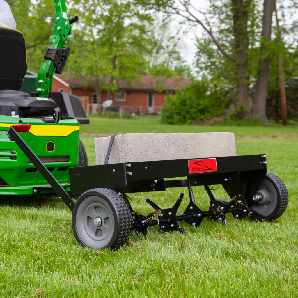 Brinly-Hardy 40 Inch Tow Behind Plug Aerator Attachment for Riding Lawn Mowers.