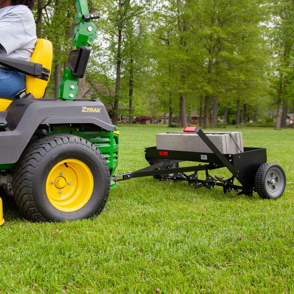 Brinly-Hardy 40 Inch Tow Behind Plug Aerator Attachment for Riding Lawn Mowers.