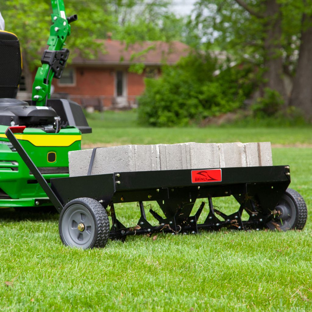 Brinly-Hardy 48 Inch Tow Behind Plug Aerator Attachment for Riding Lawn Mowers.