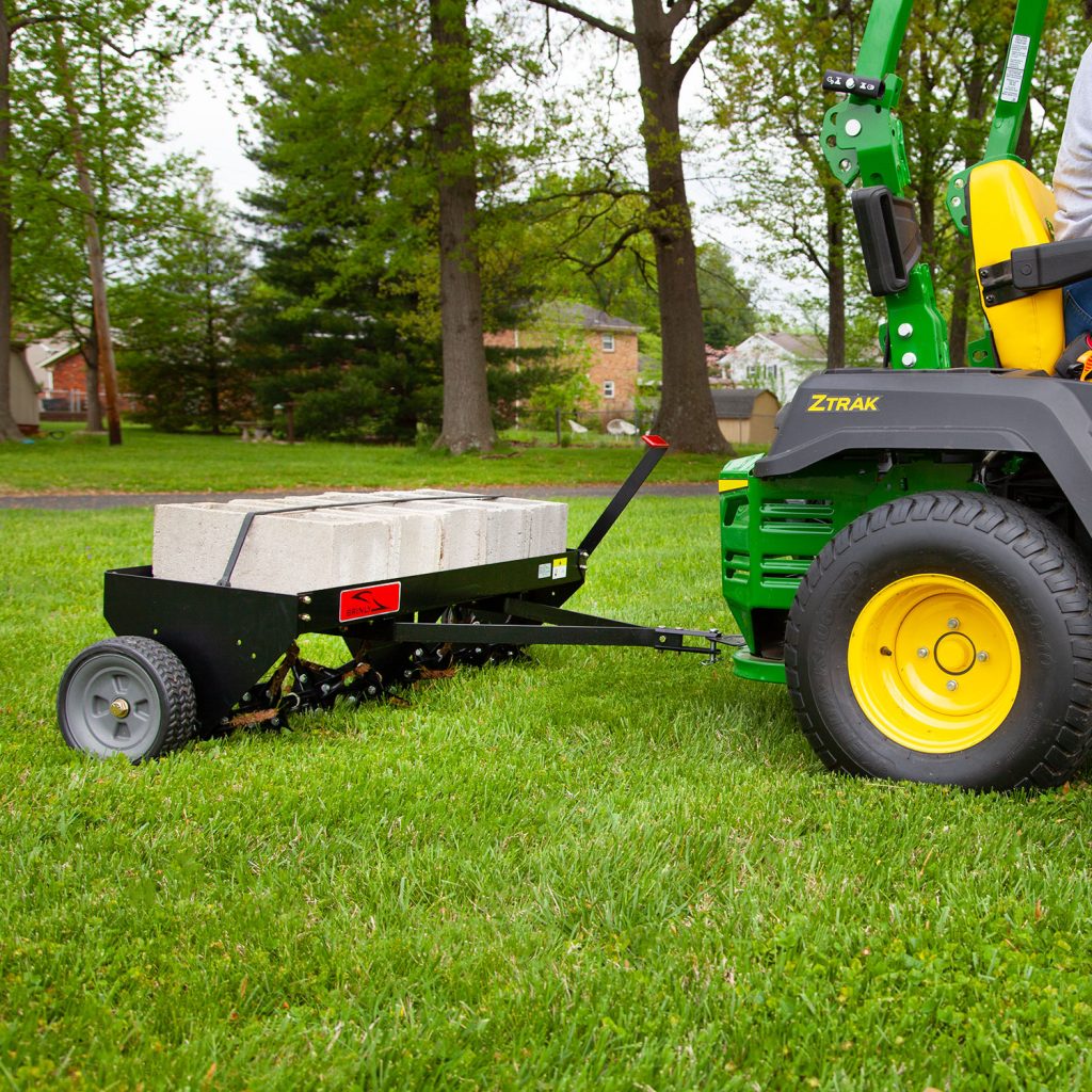 Brinly-Hardy 48 Inch Tow Behind Plug Aerator Attachment for Riding Lawn Mowers.