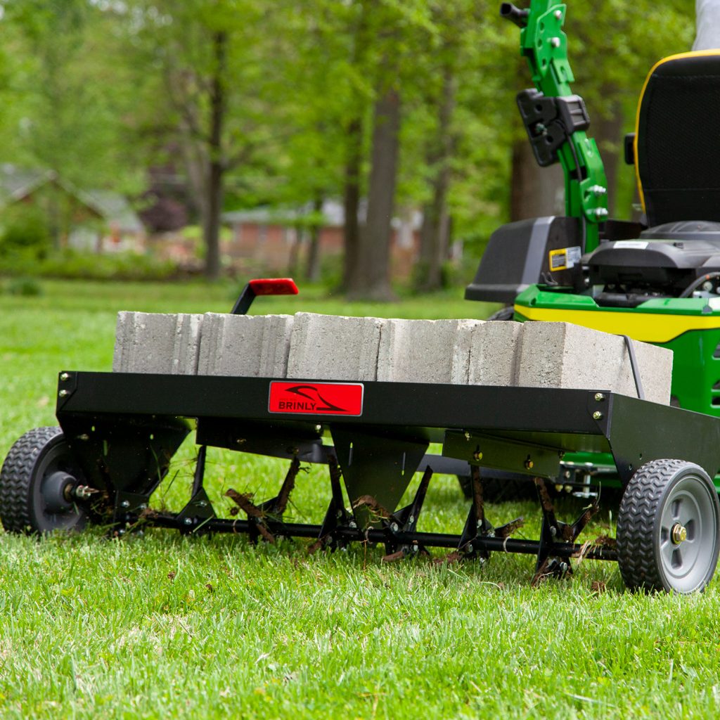 Brinly-Hardy 48 Inch Tow Behind Plug Aerator Attachment for Riding Lawn Mowers.