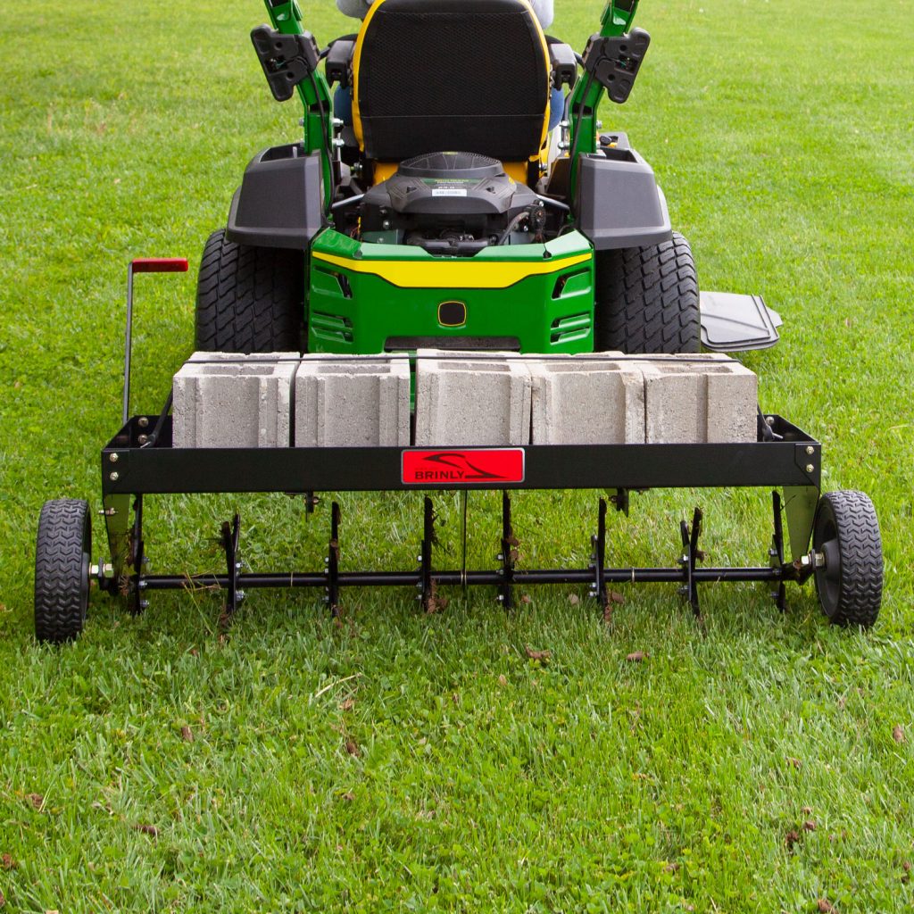 Brinly-Hardy 48 Inch Tow Behind Plug Aerator Attachment for Riding Lawn Mowers.