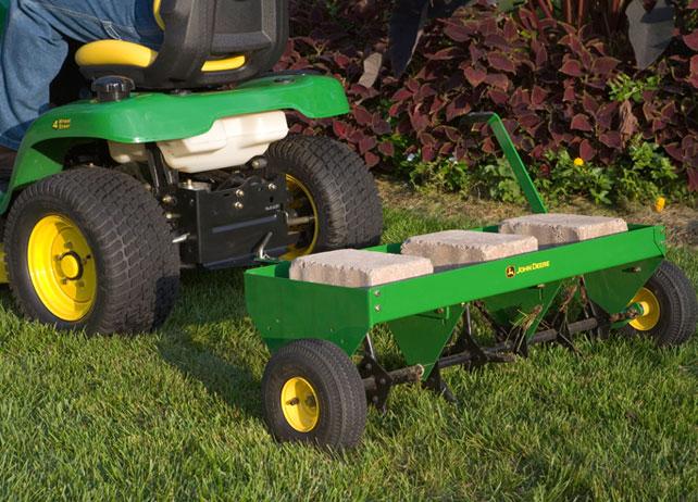 John Deere 48 Inch Tow Behind Plug Aerator Attachment for Riding Lawn Mowers.