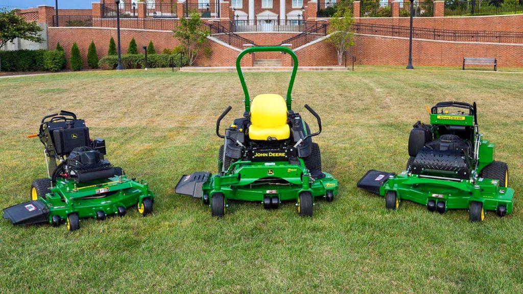Display of essential lawn equipment and attachments including mulching kits, baggers, aerators, and dethatchers for effective year-round lawn care